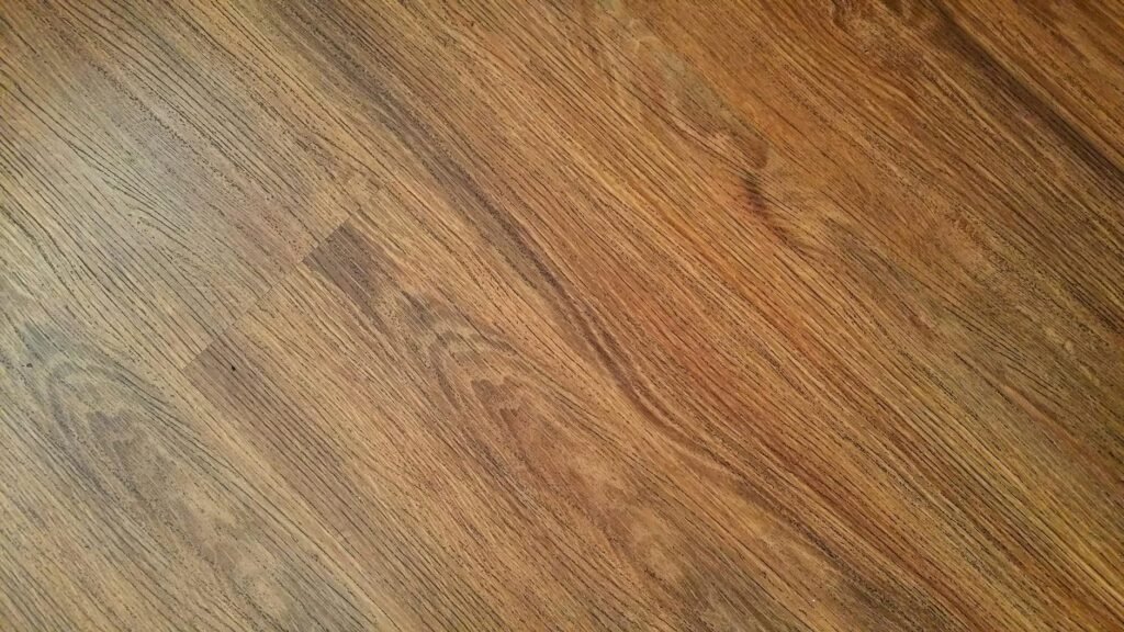 Detailed image of rustic wooden flooring with visible wood grain texture.